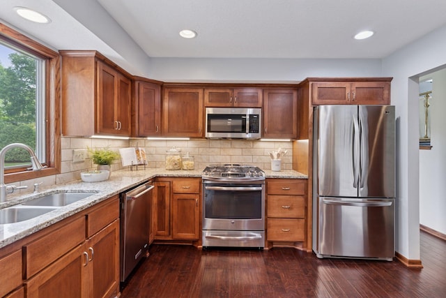 3291 Hillsboro Ave S, Saint Louis Park, MN 55426 - kitchen featuring stainless steel appliances, healthy amount of natural light, light stone countertops, dark wood-style flooring, and recessed lighting