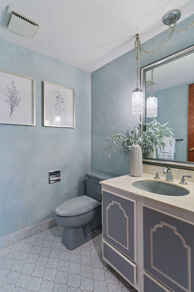 3291 Hillsboro Ave S, Saint Louis Park, MN 55426 - half bathroom with vanity, a textured ceiling, and tile patterned floors