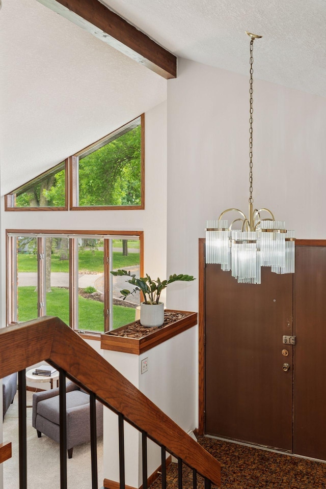 3291 Hillsboro Ave S, Saint Louis Park, MN 55426 - carpeted foyer entrance featuring a chandelier, healthy amount of natural light, and a textured ceiling