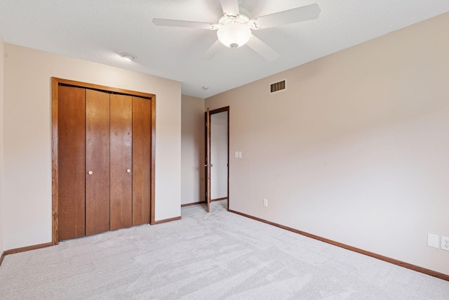 3291 Hillsboro Ave S, Saint Louis Park, MN 55426 - unfurnished bedroom with a closet, light colored carpet, and ceiling fan