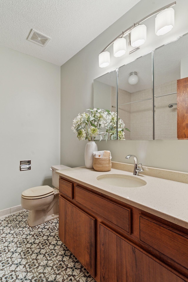 3291 Hillsboro Ave S, Saint Louis Park, MN 55426 - full bathroom featuring vanity, a tile shower, and a textured ceiling