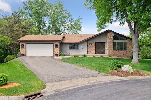 3291 Hillsboro Ave S, Saint Louis Park, MN 55426 - view of front of property featuring driveway, an attached garage, brick siding, a front yard, and a chimney