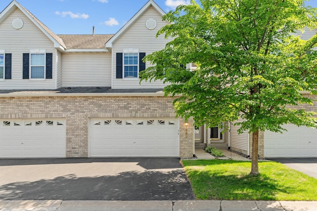 1353 White Oak Dr, Chaska, MN 55318 - view of front of home featuring brick siding and asphalt driveway