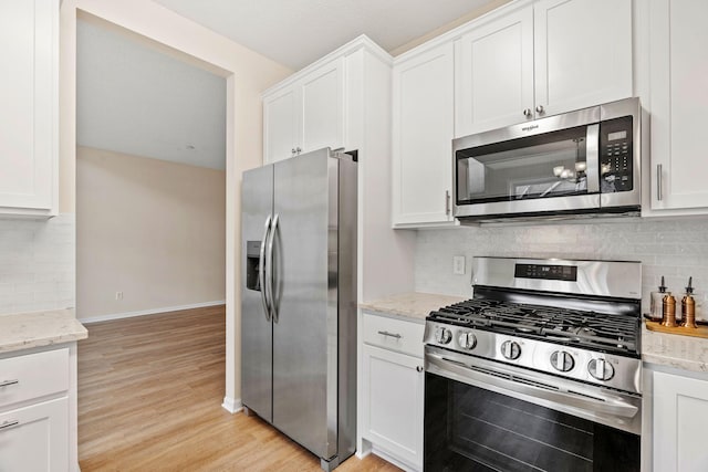 1353 White Oak Dr, Chaska, MN 55318 - kitchen with stainless steel appliances, white cabinetry, and light wood finished floors