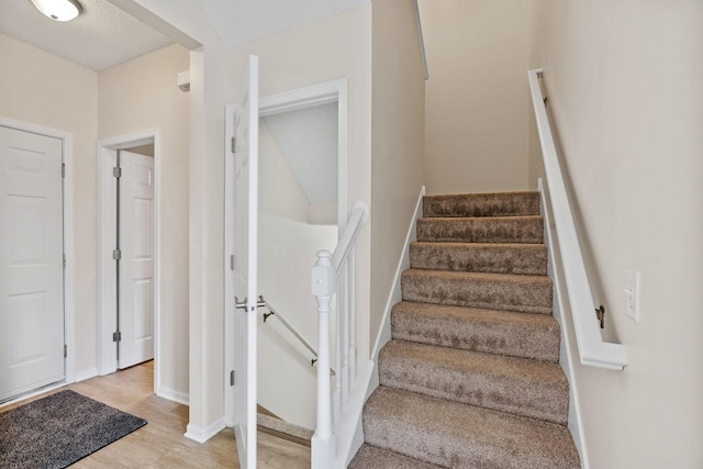 1353 White Oak Dr, Chaska, MN 55318 - staircase with wood finished floors and baseboards