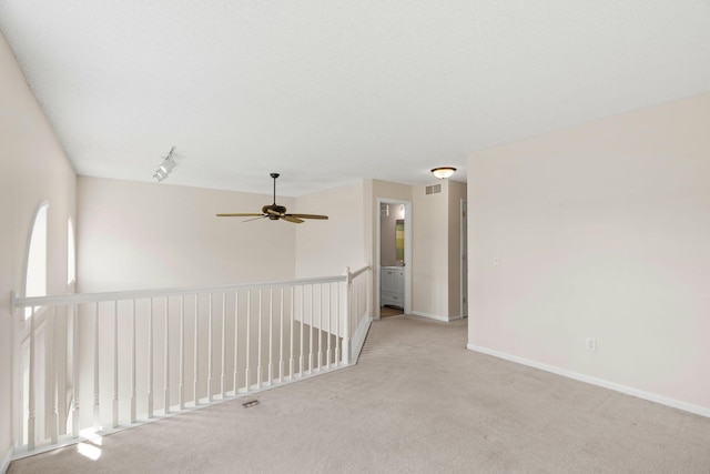 1353 White Oak Dr, Chaska, MN 55318 - spare room with a ceiling fan, light carpet, and baseboards