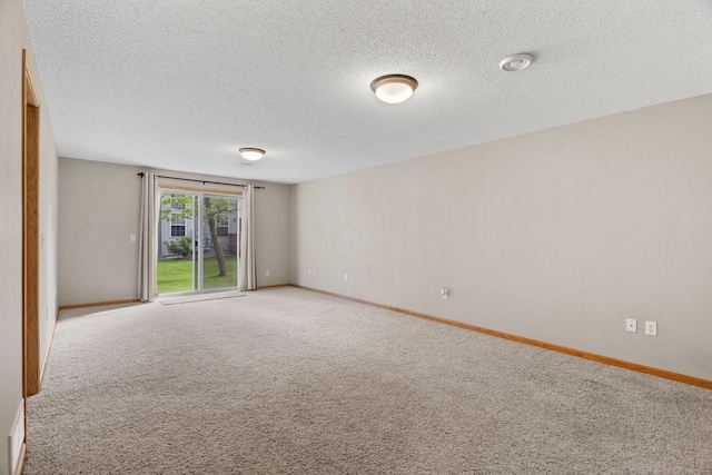 1353 White Oak Dr, Chaska, MN 55318 - spare room featuring carpet, a textured ceiling, and baseboards