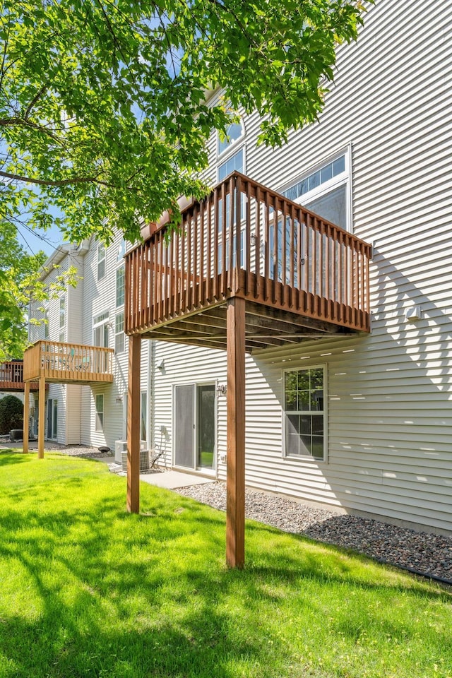 1353 White Oak Dr, Chaska, MN 55318 - rear view of property featuring a deck and a lawn