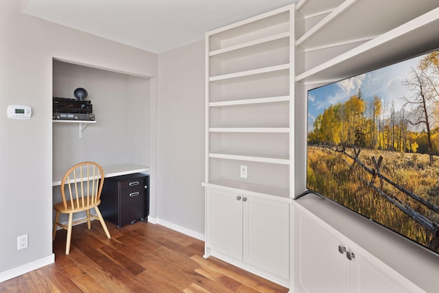 office area featuring wood finished floors and baseboards