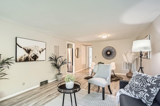 6670 Hopi Rd, Chanhassen, MN 55317 - living area with light wood-style flooring and baseboards