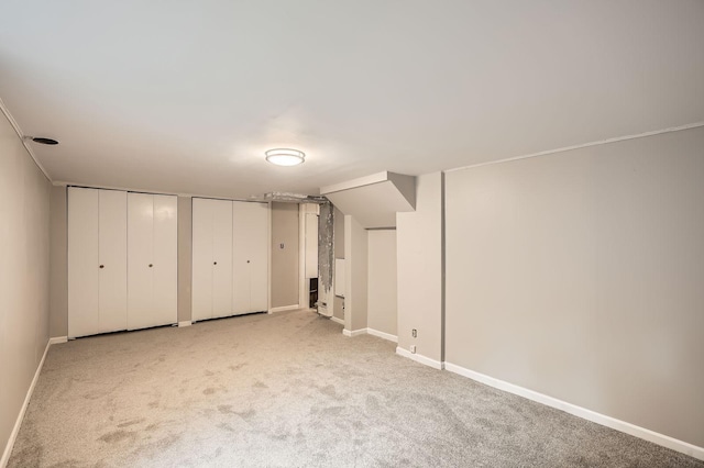 6670 Hopi Rd, Chanhassen, MN 55317 - unfurnished bedroom featuring carpet, multiple closets, and baseboards