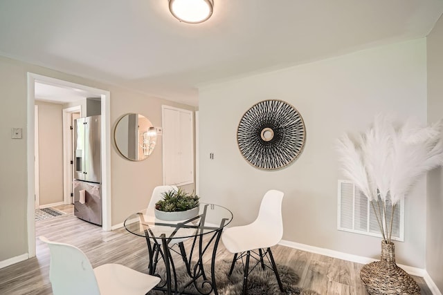 6670 Hopi Rd, Chanhassen, MN 55317 - dining space with light wood-style floors and baseboards