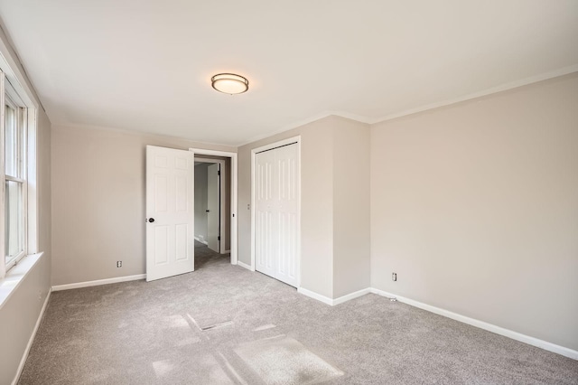 6670 Hopi Rd, Chanhassen, MN 55317 - unfurnished bedroom with carpet floors, baseboards, and a closet