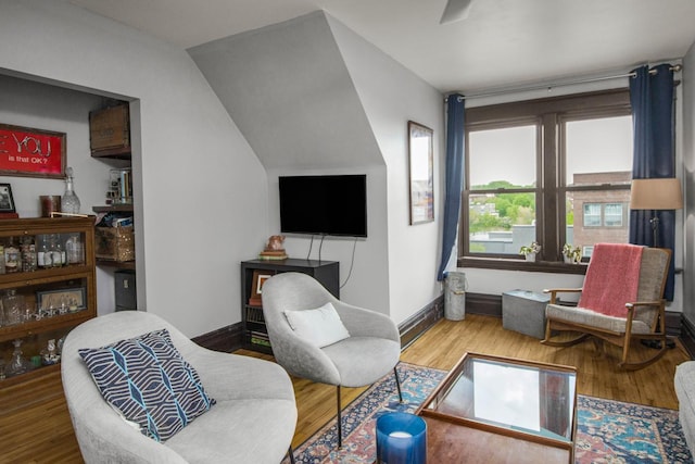 sitting room featuring baseboards and wood finished floors