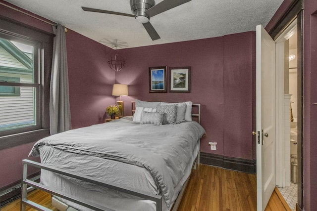 bedroom with wood finished floors and a ceiling fan