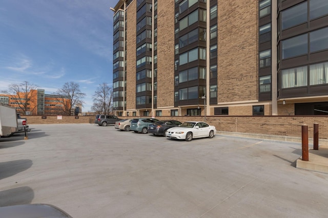 207 5th Ave SW Unit 407, Rochester, MN 55902 - view of apartment building / complex featuring uncovered parking