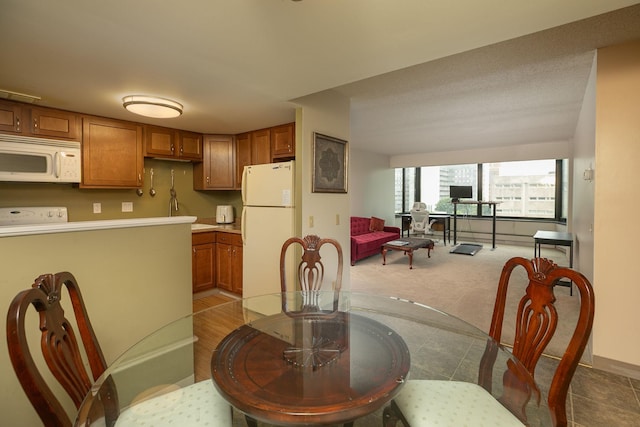 207 5th Ave SW Unit 407, Rochester, MN 55902 - dining area featuring baseboards and carpet floors