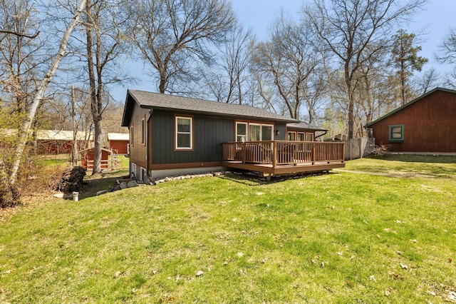 back of property featuring a wooden deck