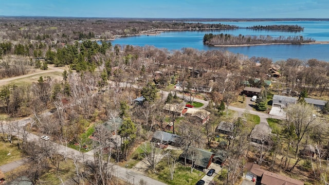 aerial view of property's location with a large body of water