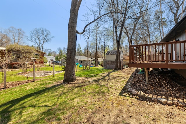 30432 Pinewood Dr, Breezy Point, MN 56472 - view of grassy yard with a deck and a playground