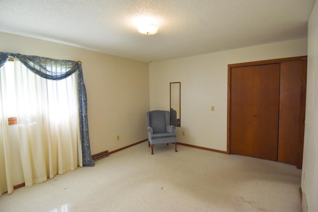 13946 151st St NE, Thief River Falls, MN 56701 - unfurnished room featuring carpet flooring, a textured ceiling, and baseboards