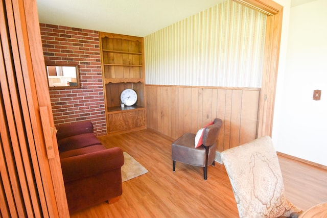 13946 151st St NE, Thief River Falls, MN 56701 - sitting room featuring wood finished floors, built in shelves, wood walls, and baseboards