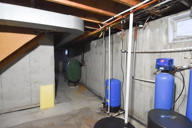 13946 151st St NE, Thief River Falls, MN 56701 - unfinished below grade area with oil tank, a water pressure tank, and a water softener system