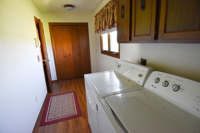 13946 151st St NE, Thief River Falls, MN 56701 - laundry room featuring wood finished floors, washer and dryer, and cabinet space