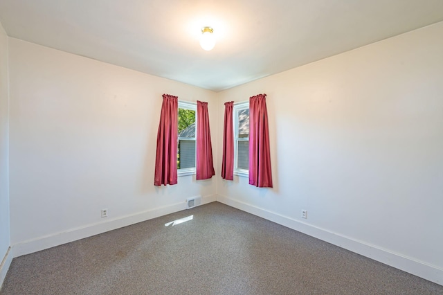 1202 Webster St, Fairmont, MN 56031 - unfurnished room with baseboards and dark colored carpet