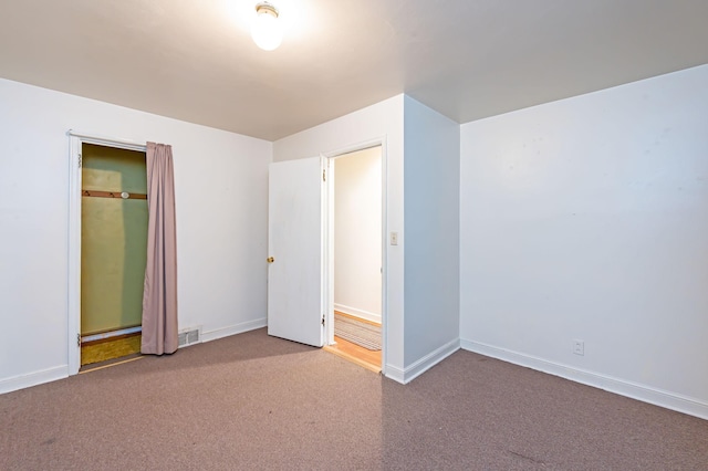 1202 Webster St, Fairmont, MN 56031 - unfurnished bedroom with carpet floors and baseboards
