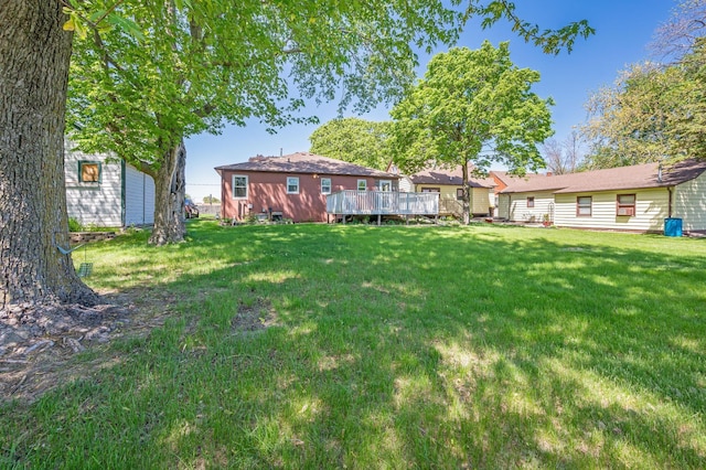 1202 Webster St, Fairmont, MN 56031 - view of green lawn with a wooden deck