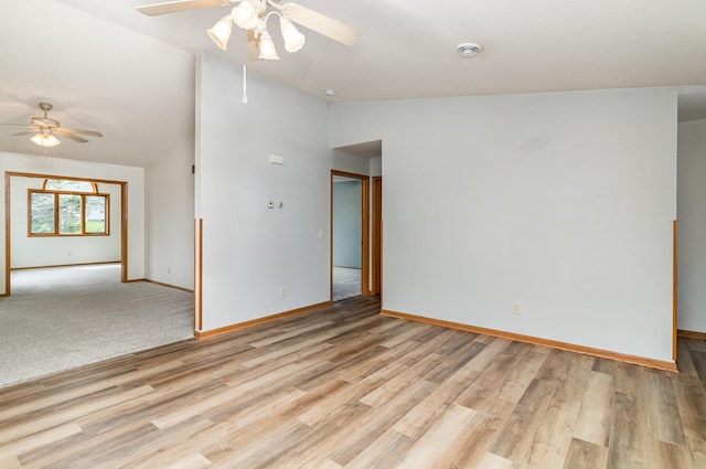 202 6th St NE, Montgomery, MN 56069 - empty room with a ceiling fan, lofted ceiling, baseboards, and light wood finished floors