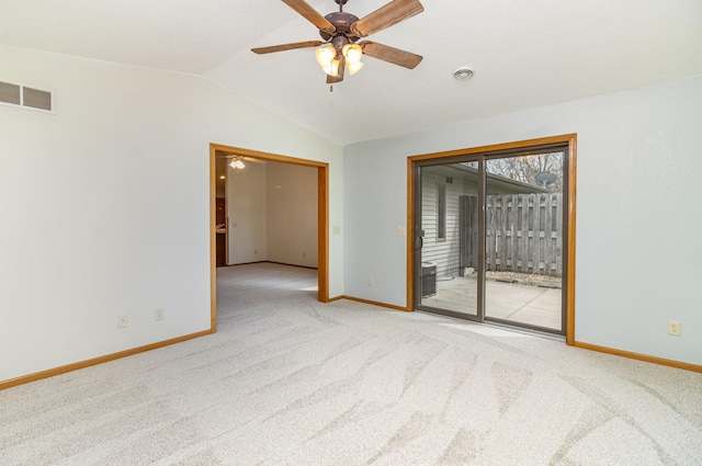 202 6th St NE, Montgomery, MN 56069 - unfurnished room with vaulted ceiling, carpet flooring, baseboards, and a ceiling fan