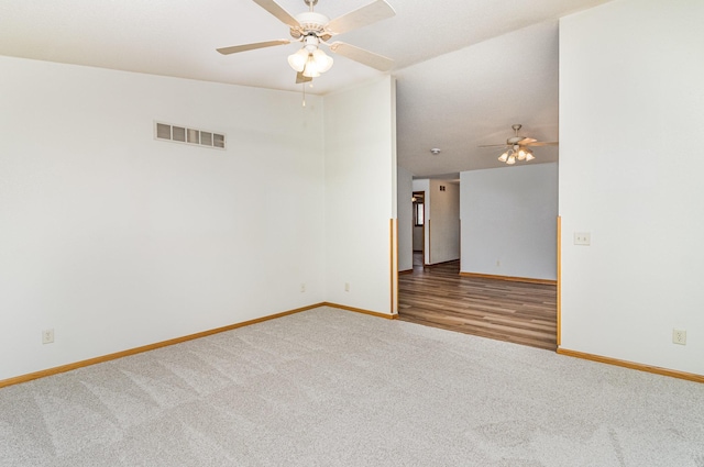 202 6th St NE, Montgomery, MN 56069 - carpeted spare room with a ceiling fan, baseboards, and lofted ceiling