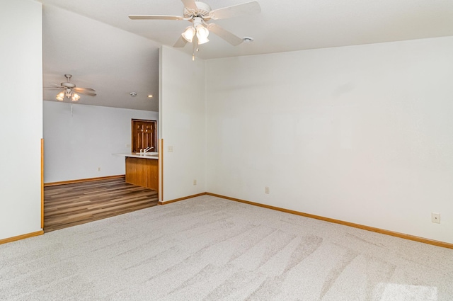 202 6th St NE, Montgomery, MN 56069 - carpeted spare room featuring baseboards and a ceiling fan
