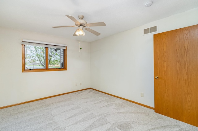 202 6th St NE, Montgomery, MN 56069 - carpeted empty room featuring a smoke detector, ceiling fan, and baseboards