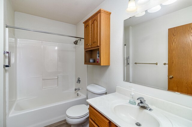 202 6th St NE, Montgomery, MN 56069 - bathroom with toilet, vanity, and shower / tub combination