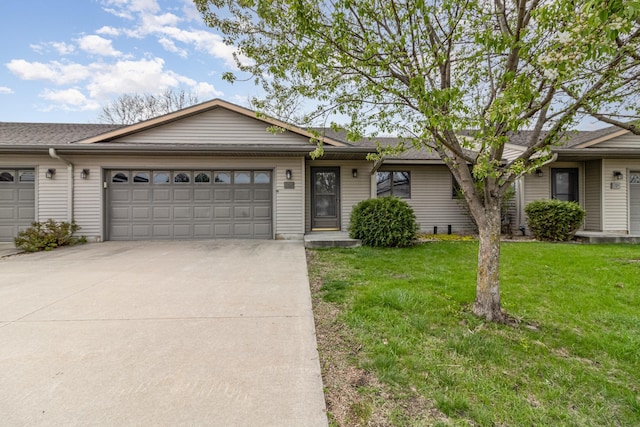 202 6th St NE, Montgomery, MN 56069 - ranch-style house with driveway, a front lawn, a garage, and roof with shingles