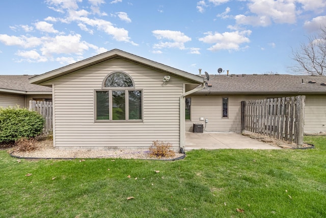 202 6th St NE, Montgomery, MN 56069 - rear view of house with a patio area and central AC