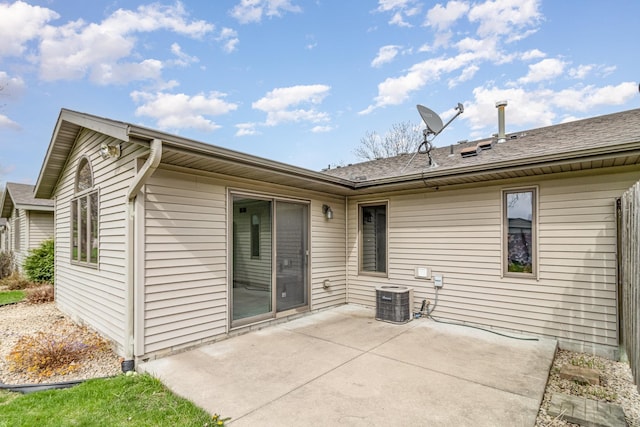 202 6th St NE, Montgomery, MN 56069 - rear view of house featuring a patio area and central air condition unit