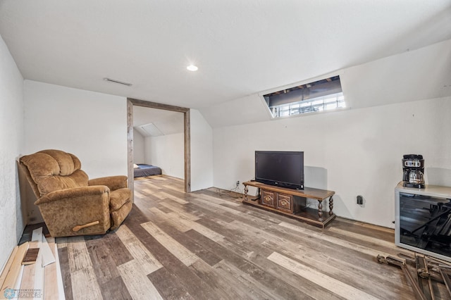 1204 12th Ave N, Moorhead, MN 56560 - sitting room featuring wood finished floors, lofted ceiling, and wine cooler