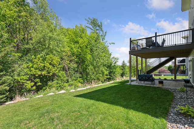 9222 Bridle Way, Victoria, MN 55386 - view of grassy yard with stairs, a patio, and a deck