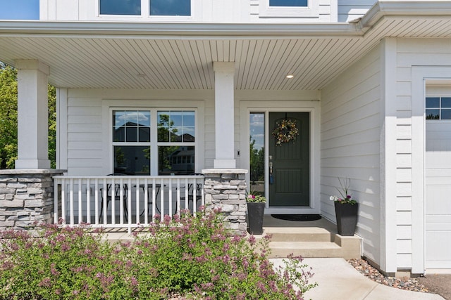 9222 Bridle Way, Victoria, MN 55386 - doorway to property featuring a porch and stone siding