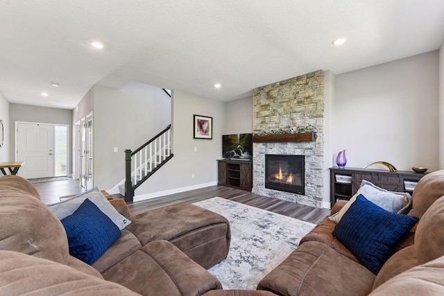 9222 Bridle Way, Victoria, MN 55386 - living area featuring stairway, wood finished floors, a stone fireplace, baseboards, and recessed lighting