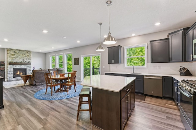 9222 Bridle Way, Victoria, MN 55386 - kitchen featuring appliances with stainless steel finishes, a sink, healthy amount of natural light, recessed lighting, and light countertops