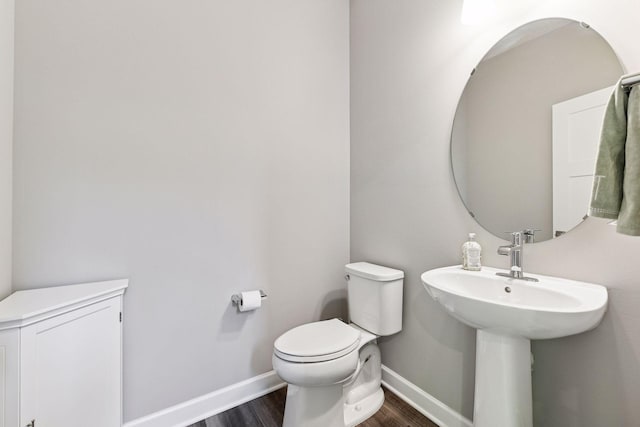 9222 Bridle Way, Victoria, MN 55386 - half bath with wood finished floors, baseboards, and toilet