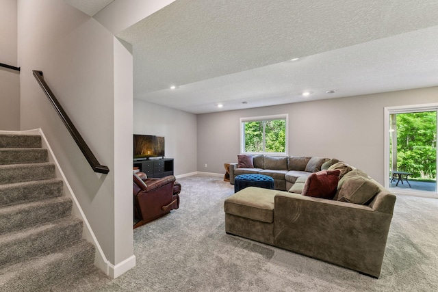 9222 Bridle Way, Victoria, MN 55386 - carpeted living area featuring healthy amount of natural light, recessed lighting, a textured ceiling, stairway, and baseboards