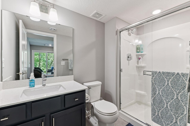9222 Bridle Way, Victoria, MN 55386 - bathroom featuring toilet, a stall shower, vanity, and a textured ceiling