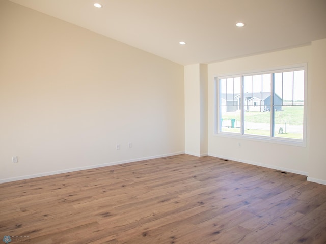 10302 Burgundy Dr, Horace, ND 58047 - spare room with wood finished floors, recessed lighting, and baseboards