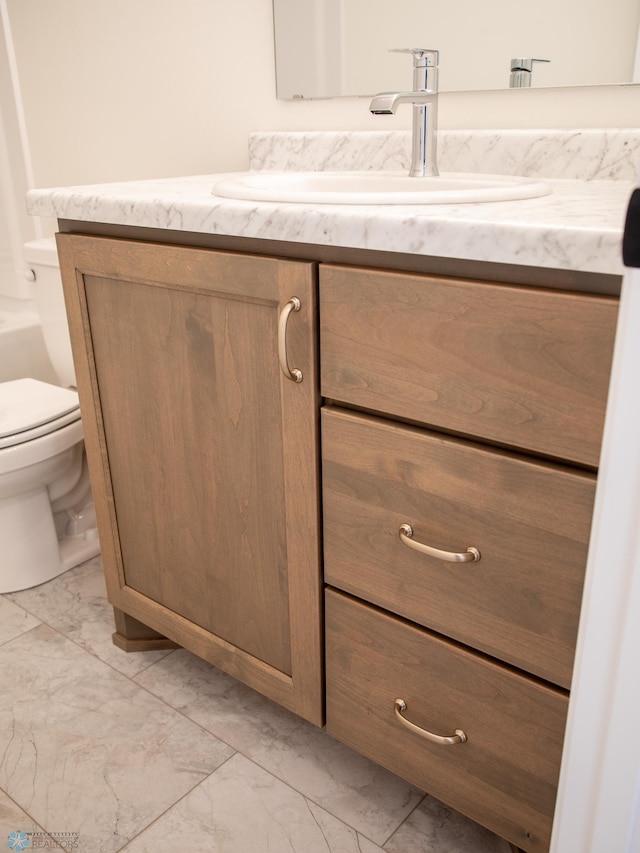 10302 Burgundy Dr, Horace, ND 58047 - half bath featuring marble look tiles, vanity, and toilet